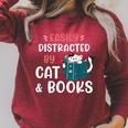 Easily Distracted By Cats And Books Cat & Book Lover For Men Women Kids Raglan Sleeve Sweatshirt Heather Dust Easily Distracted By Cats And Books Cat & Book Lover For Men Women Kids Raglan Sleeve Sweatshirt Heather Dust
