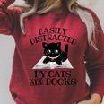 Easily Distracted By Cats And Books Cat Book Lover Raglan Sleeve Sweatshirt Heather Dust