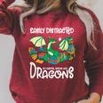 Easily Distracted By Coffee Books And Dragons Fantasy Sci-Fi Raglan Sleeve Sweatshirt Heather Dust