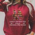 Easily Distracted By Dragon And Book Apparel Raglan Sleeve Sweatshirt Heather Dust