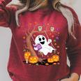 Ghost Reading Book On Swing Halloween Autumn Art Raglan Sleeve Sweatshirt Heather Dust