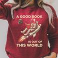 A Good Book Out Of This World Astronaut Space Reading Lovers Raglan Sleeve Sweatshirt Heather Dust
