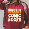 A Good Life Is A Collection Of Comic Books Graphic Vintage Raglan Sleeve Sweatshirt Heather Dust