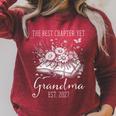 Grandma Est 2027 Best Chapter Yet Floral Book Raglan Sleeve Sweatshirt Heather Dust