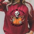 Leave Me Alone I'm Reading Skeleton Reading Book Bookish Raglan Sleeve Sweatshirt Heather Dust