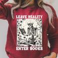 Leave Reality Enter Books Skeleton Reading Book Raglan Sleeve Sweatshirt Heather Dust Leave Reality Enter Books Skeleton Reading Book Raglan Sleeve Sweatshirt Heather Dust