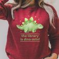 The Library Is Dino-Mite Stegosaurus Reading Kids Book Raglan Sleeve Sweatshirt Heather Dust