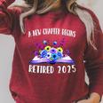 A New Chapter Begins Retired 2025 Floral Book Retirement Raglan Sleeve Sweatshirt Heather Dust A New Chapter Begins Retired 2025 Floral Book Retirement Raglan Sleeve Sweatshirt Heather Dust