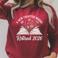 New Chapter Begins Retired 2026 Floral Book Retirement Women Raglan Sleeve Sweatshirt Heather Dust