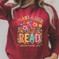 Plant A Seed Read Library Summer Reading 2026 Floral Book Raglan Sleeve Sweatshirt Heather Dust Plant A Seed Read Library Summer Reading 2026 Floral Book Raglan Sleeve Sweatshirt Heather Dust