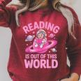 Reading Is Out Of This World Astronaut Reading Book Space Raglan Sleeve Sweatshirt Heather Dust Reading Is Out Of This World Astronaut Reading Book Space Raglan Sleeve Sweatshirt Heather Dust