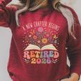 Retired 2026 A New Chapter Begins Floral Book Raglan Sleeve Sweatshirt Heather Dust Retired 2026 A New Chapter Begins Floral Book Raglan Sleeve Sweatshirt Heather Dust