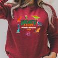 Summer Reading 2026 Unearth A Story Dinosaurs Book Lover Raglan Sleeve Sweatshirt Heather Dust
