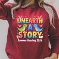 Summer Reading Unearth A Story Dinosaur Books 2026 Raglan Sleeve Sweatshirt Heather Dust Summer Reading Unearth A Story Dinosaur Books 2026 Raglan Sleeve Sweatshirt Heather Dust