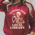 Support Your Local Library Skeleton Reading Books Librarian Raglan Sleeve Sweatshirt Heather Dust Support Your Local Library Skeleton Reading Books Librarian Raglan Sleeve Sweatshirt Heather Dust