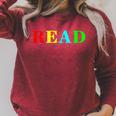 Teacher Reading Read In Color Book Raglan Sleeve Sweatshirt Heather Dust