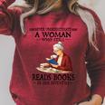 Never Underestimate A Woman Who Still Reads Books In Her Raglan Sleeve Sweatshirt Heather Dust