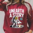 Unearth A Story Astronaut Finds Book On The Moon Raglan Sleeve Sweatshirt Heather Dust