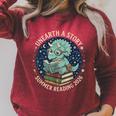 Unearth A Story Summer Reading 2026 Cute Dinosaur Reading Raglan Sleeve Sweatshirt Heather Dust Unearth A Story Summer Reading 2026 Cute Dinosaur Reading Raglan Sleeve Sweatshirt Heather Dust