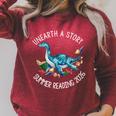 Unearth A Story Summer Reading 2026 Cute Plesiosaurus Book Raglan Sleeve Sweatshirt Heather Dust