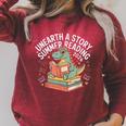 Unearth A Story Summer Reading 2026 Dinosaur Books Raglan Sleeve Sweatshirt Heather Dust Unearth A Story Summer Reading 2026 Dinosaur Books Raglan Sleeve Sweatshirt Heather Dust