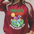 Unearth A Story Summer Reading Program 2026 Animals Book Raglan Sleeve Sweatshirt Heather Dust Unearth A Story Summer Reading Program 2026 Animals Book Raglan Sleeve Sweatshirt Heather Dust
