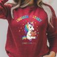 Unicorn Reading a Book Unearth a Story Program 2026 Raglan Sleeve Sweatshirt Heather Dust