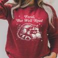Vintage Feral But Well Read Raccoon Reading Book Lover Raglan Sleeve Sweatshirt Heather Dust