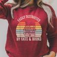 Vintage Retro Easily Distracted By Cats And Books Cat Raglan Sleeve Sweatshirt Heather Dust Vintage Retro Easily Distracted By Cats And Books Cat Raglan Sleeve Sweatshirt Heather Dust