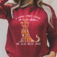 A Woman Cannot Survive On Books Alone She Also Needs Dogs Raglan Sleeve Sweatshirt Heather Dust