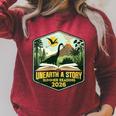 Women's 2026 Summer Reading Unearth a Story Teachers Students Book Raglan Sleeve Sweatshirt Heather Dust Women's 2026 Summer Reading Unearth a Story Teachers Students Book Raglan Sleeve Sweatshirt Heather Dust