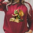 Women's Dragon Bookworm Reading Book Graphic Raglan Sleeve Sweatshirt Heather Dust Women's Dragon Bookworm Reading Book Graphic Raglan Sleeve Sweatshirt Heather Dust