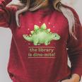 Women's The Library Is Dino-Mite Stegosaurus Reading Kids Book Raglan Sleeve Sweatshirt Heather Dust