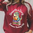 Women's Unearth a Story Summer Reading 2026 Book Lover Dino Fun Raglan Sleeve Sweatshirt Heather Dust