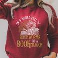 In A World Full Of Bookworms Be A Book Dragon Raglan Sleeve Sweatshirt Heather Dust In A World Full Of Bookworms Be A Book Dragon Raglan Sleeve Sweatshirt Heather Dust