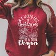 IN A WORLD FULL OF BOOKWORMS BE A Book Dragon Reader Raglan Sleeve Sweatshirt Heather Dust