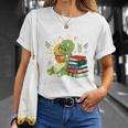 Unearth a Story Triceratops Dinosaur Reading Books Cute Dino Premium Tri-Blend T-Shirt Gifts for Her