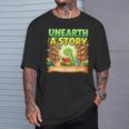 Unearth A Story Dinosaur Summer Reading 2026 Books T-Shirt Gifts for Him Unearth A Story Dinosaur Summer Reading 2026 Books T-Shirt Gifts for Him