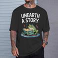 Unearth a Story Frog Reading a Book Summer 2026 T-Shirt Gifts for Him