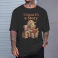 Unearth a Story Triceratops Dinosaur Reading Books Dino T-Shirt Gifts for Him