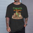 Women's Unearth a Story Summer 2026 Dinosaur Reading Books Dino T-Shirt Gifts for Him Women's Unearth a Story Summer 2026 Dinosaur Reading Books Dino T-Shirt Gifts for Him