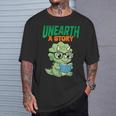 Women's Unearth a Story Summer Reading 2026 Triceratops Dino Book T-Shirt Gifts for Him