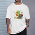Unearth a Story Triceratops Dinosaur Reading Books Cute Dino Premium Tri-Blend T-Shirt Gifts for Him