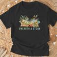 Unearth a Story Dinosaur 2026 Summer Reading Program Book T-Shirt Gifts for Old Men Unearth a Story Dinosaur 2026 Summer Reading Program Book T-Shirt Gifts for Old Men