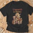 Women's Unearth a Story Triceratops Dinosaur Reading Books Dino T-Shirt Gifts for Old Men Women's Unearth a Story Triceratops Dinosaur Reading Books Dino T-Shirt Gifts for Old Men