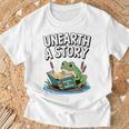 Unearth a Story Frog Reading a Book Summer 2026 Premium Tri-Blend T-Shirt Gifts for Old Men Unearth a Story Frog Reading a Book Summer 2026 Premium Tri-Blend T-Shirt Gifts for Old Men