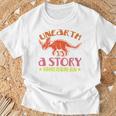 Unearth a Story Summer Reading 2026 Triceratops Dino Book Premium Tri-Blend T-Shirt Gifts for Old Men