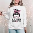 In October We Wear Pink Baseball Mom Messy Bun Breast Cancer Women Crewneck Sweatshirt In October We Wear Pink Baseball Mom Messy Bun Breast Cancer Women Crewneck Sweatshirt