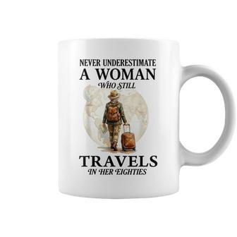 Never Underestimate A Woman Who Still Travels In Her 80'S Coffee Mug - Thegiftio UK
