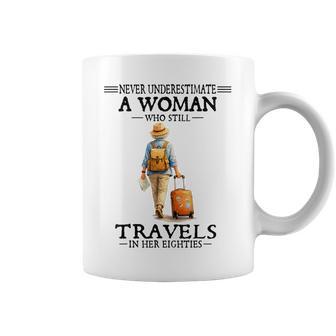 Never Underestimate A Woman Who Still Travels In Her Eightie Coffee Mug - Thegiftio UK